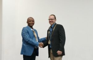 Lazarus Meko hands over the chairmanship of IQSA to Jeremy Hunter-Smith at the Kopanong Hotel and Conference Centre in Benoni, Gauteng.