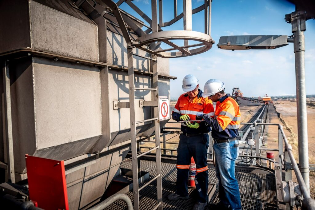 A Weba Chute Systems field advisor measuring and recording the wear components of the chute.