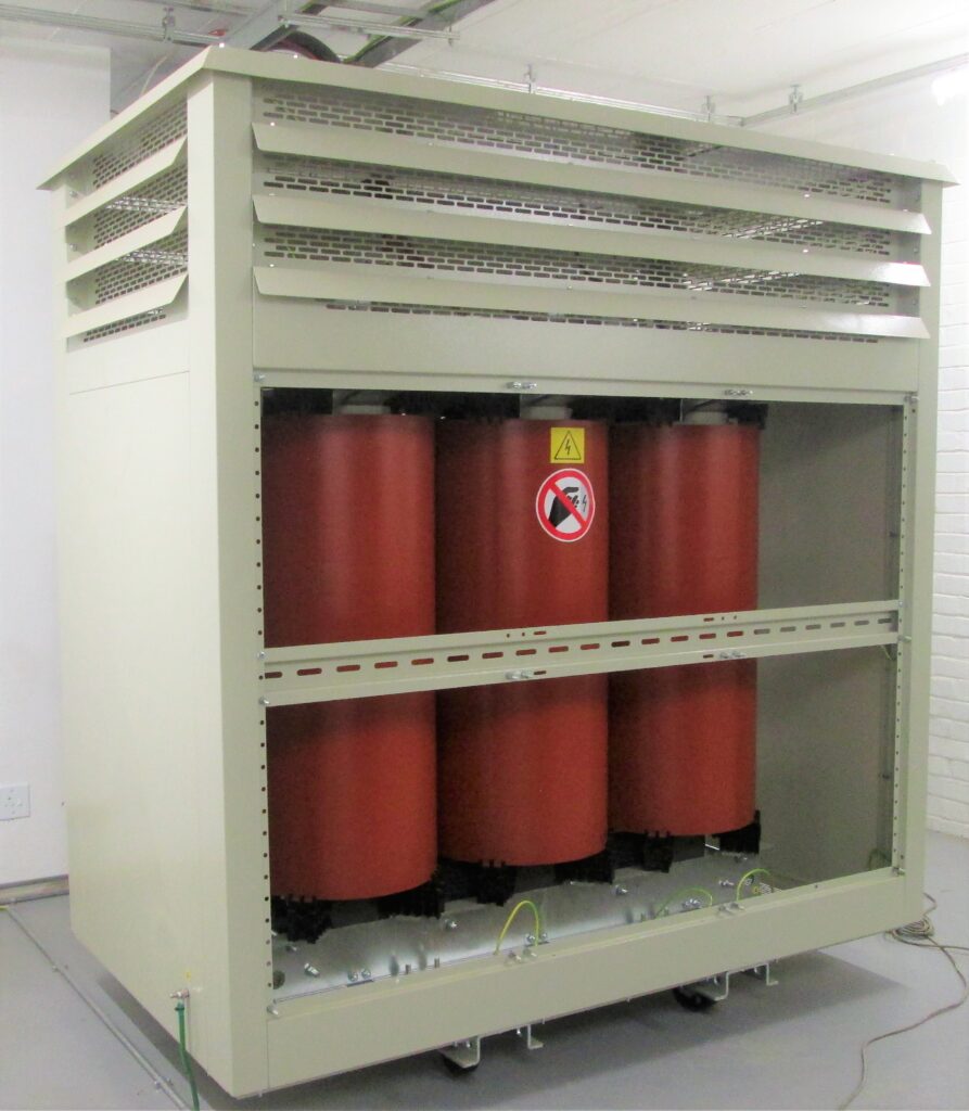 A cast resin dry-type transformer in an IP23 grade enclosure used in the mining sector.