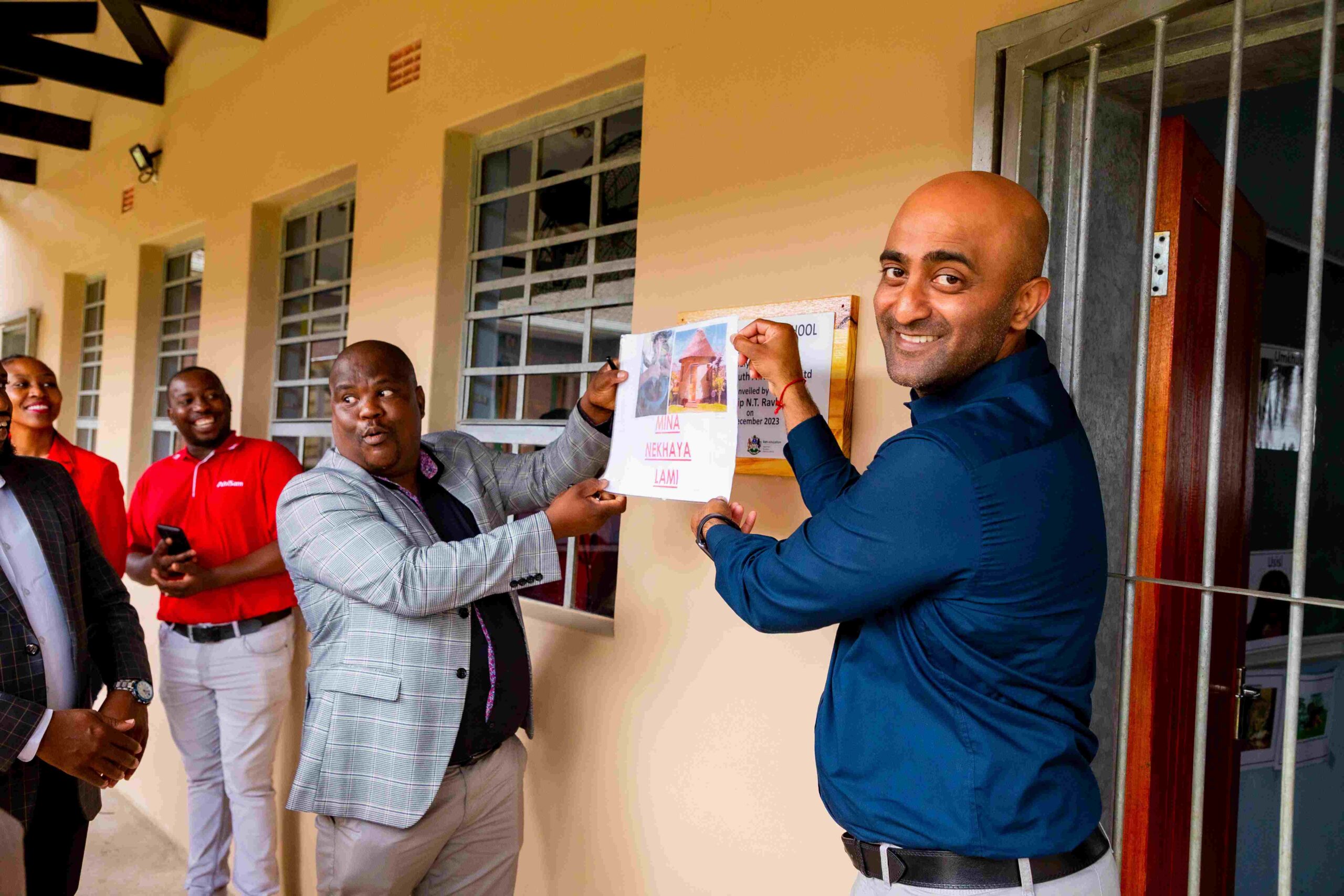 From left: Mr Majola, principal of Ningizimu Special School, with Theolan Govender, AfriSam Regional Manager, officially open the new classrooms.