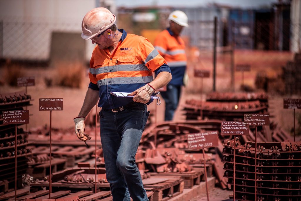 Weba Chute Systems advisors conducting inventory in a stockyard.