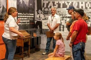 Martin Engineering Field Support Supervisor Sue Griffith talks to visitors about the company’s long history of innovation.