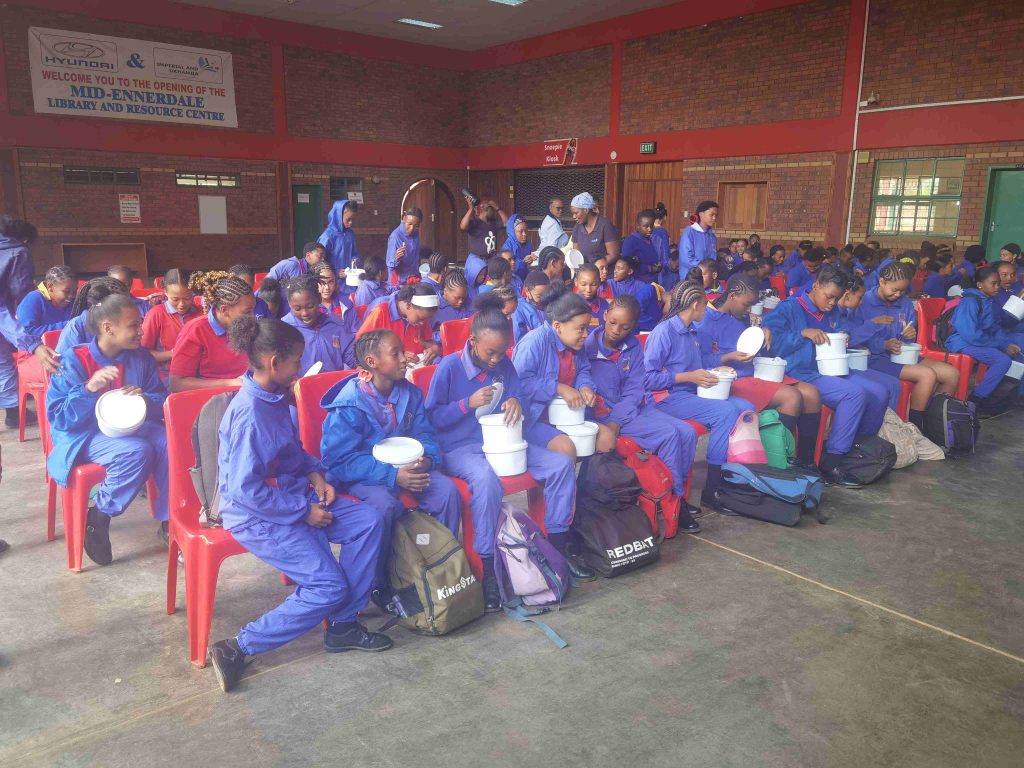 AfriSam, in partnership with RADA’s MiPad initiative, providing reusable sanitary pads to girls at the Mid-Ennerdale Primary School in Gauteng.