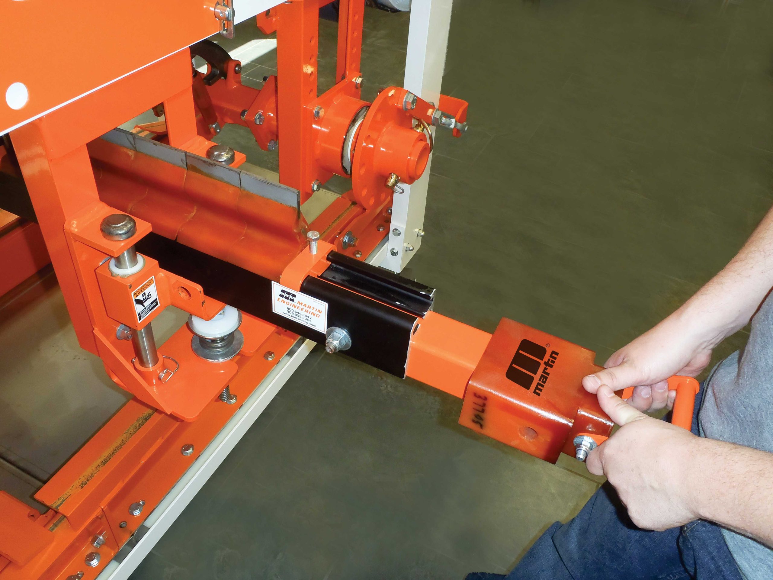 Equipment like the Martin track-mounted belt cleaners are designed to pull away from the system for safe ergonomic servicing.