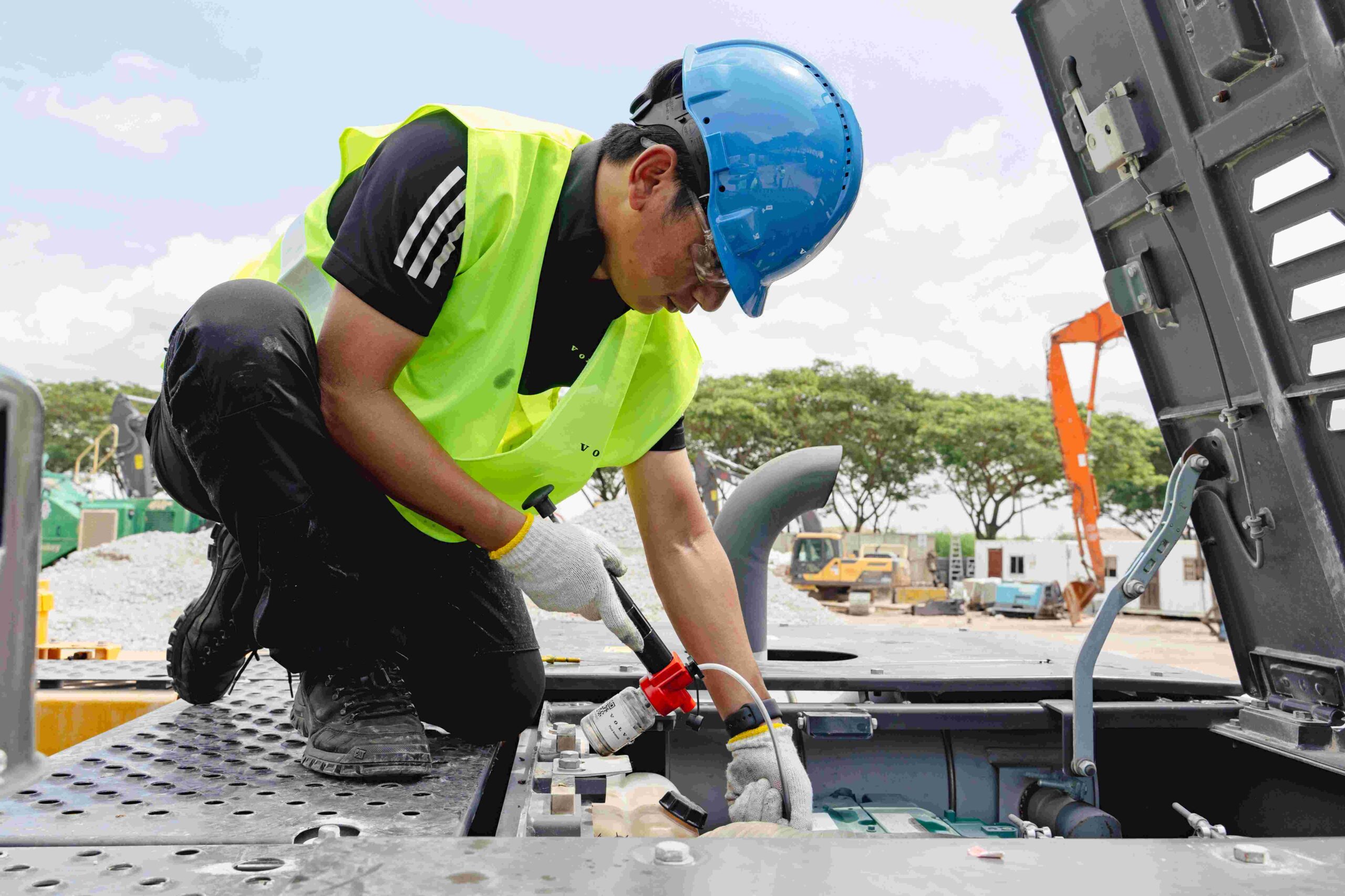 A fluid sample is collected from the machine for analysis.