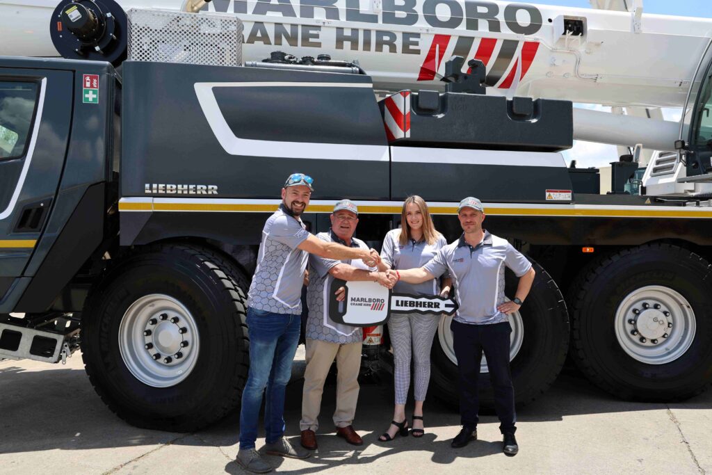 From left: Francois Pretorius of Liebherr-Africa; Oliver Dalais and Kathleen Dias from Marlboro Crane Hire; and Erik Benz from Liebherr-Africa – during the hand-over of the LTM 1100-5.3.