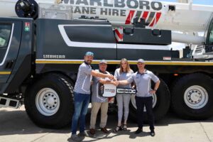 From left: Francois Pretorius of Liebherr-Africa; Oliver Dalais and Kathleen Dias from Marlboro Crane Hire; and Erik Benz from Liebherr-Africa – during the hand-over of the LTM 1100-5.3.