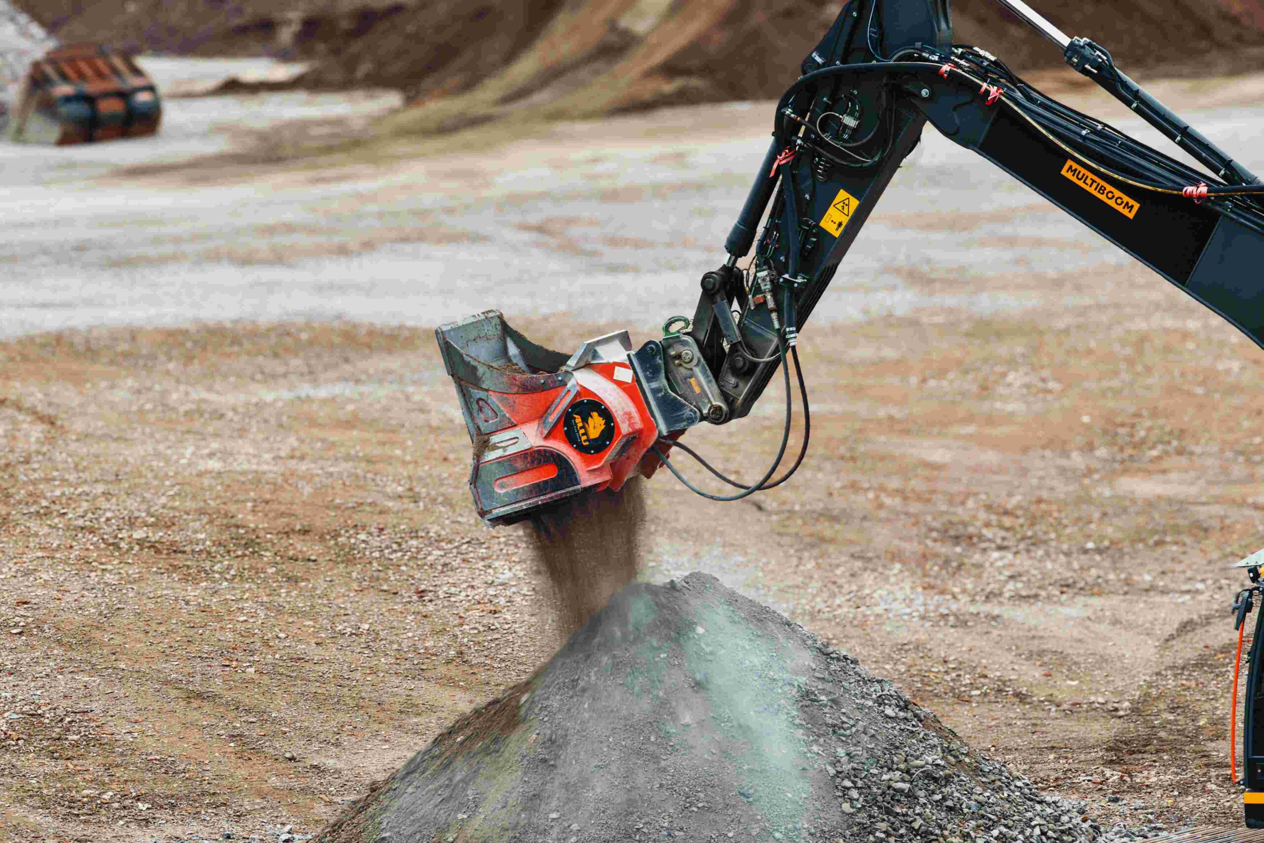 The ALLU Concrete Bucket has been developed to address these operational challenges by allowing contractors to crush and screen demolition material using the excavator already operating on the jobsite.