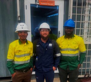 Aggrey and Martin representatives work together on a project at a mining site in Ghana.