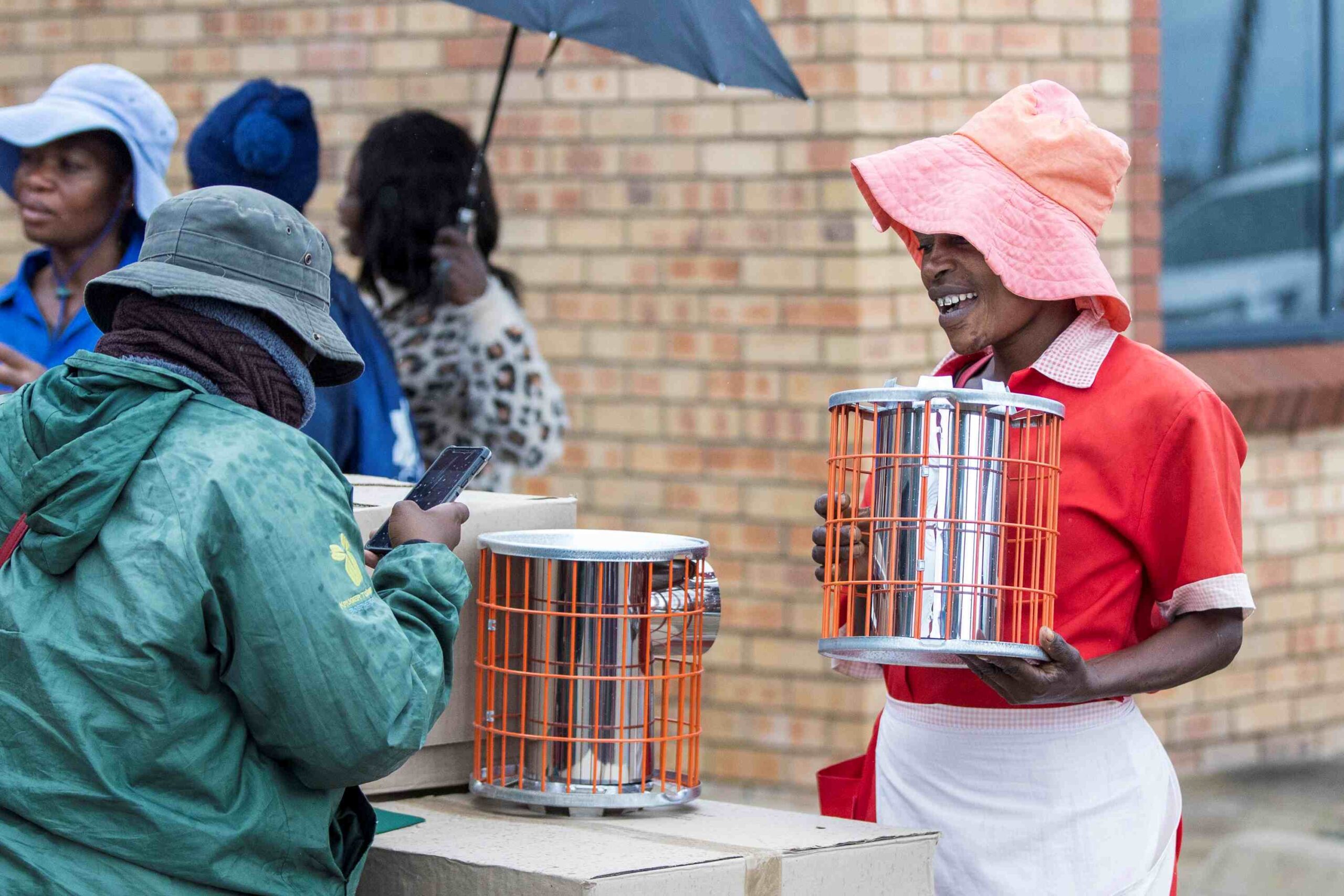 Cooking with an energy-efficient cookstove that uses less fuel and produces fewer emissions.